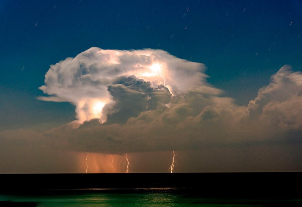 thunderclouds above an ocean
